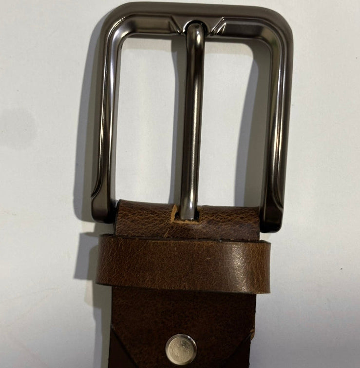 Brown leather belt with metal buckle on white background