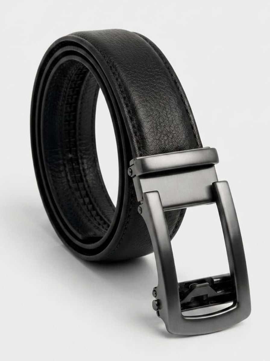 A black leather belt with a matte dark gray automatic buckle, coiled on a light gray background.