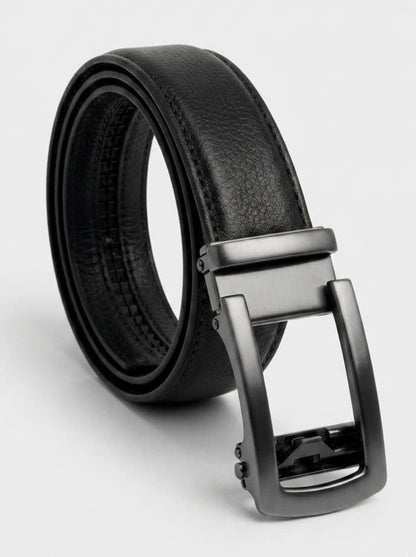 A black leather belt with a matte dark gray automatic buckle, coiled on a light gray background.