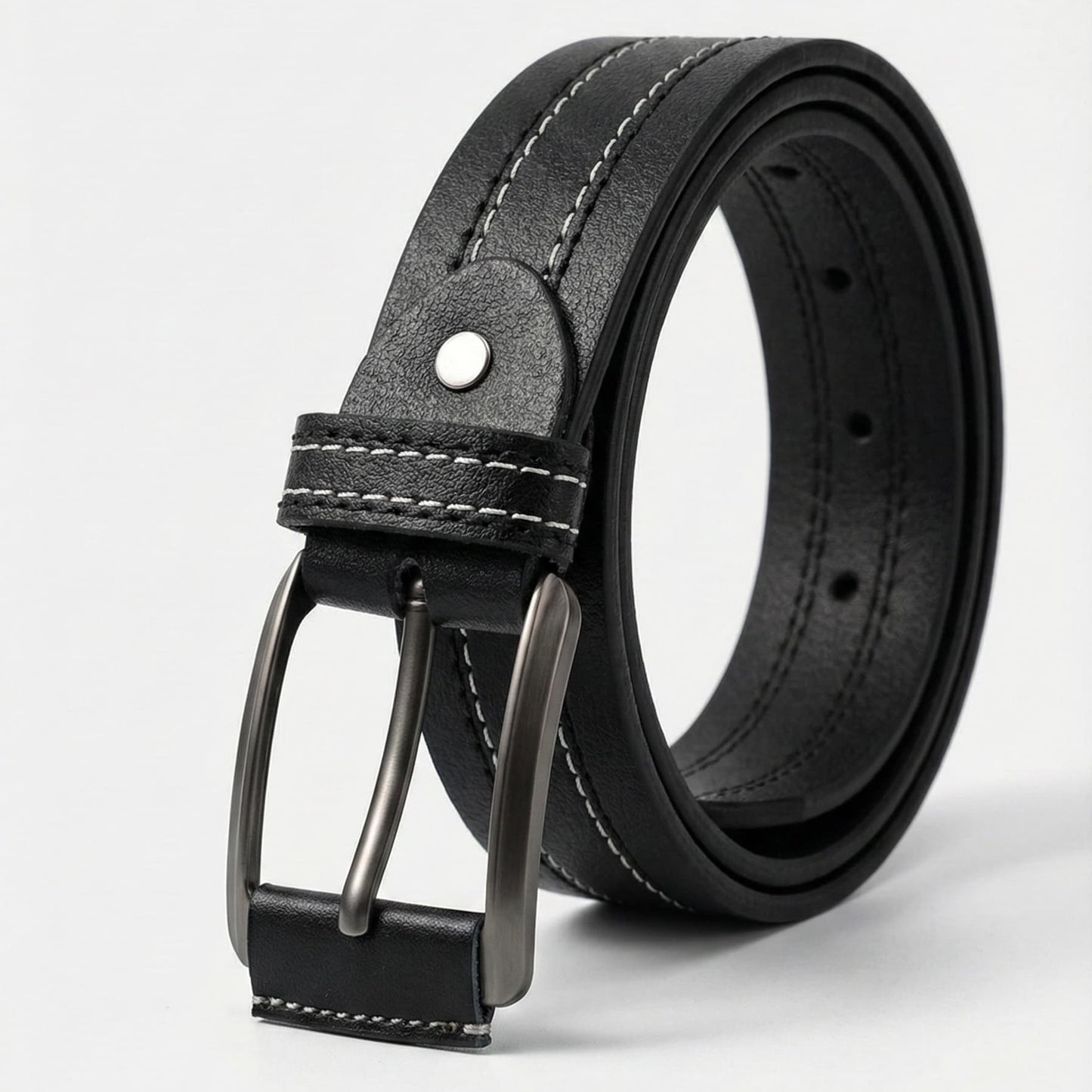 Black leather belt with a silver buckle on a light gray background