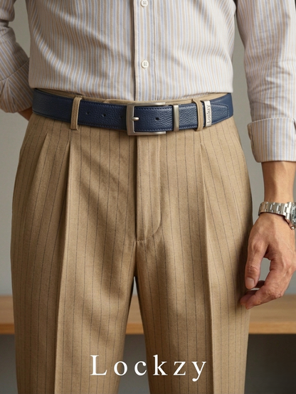 Person wearing a blue belt with a silver buckle on beige pants, with 'Lockzy' branding.