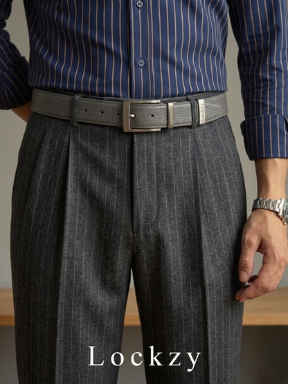Person wearing gray pleated pants with a belt and striped shirt, brand 'Lockzy' visible.
