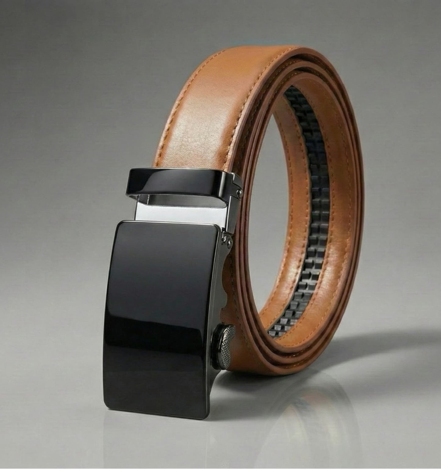 Brown belt with black buckle on a gray background